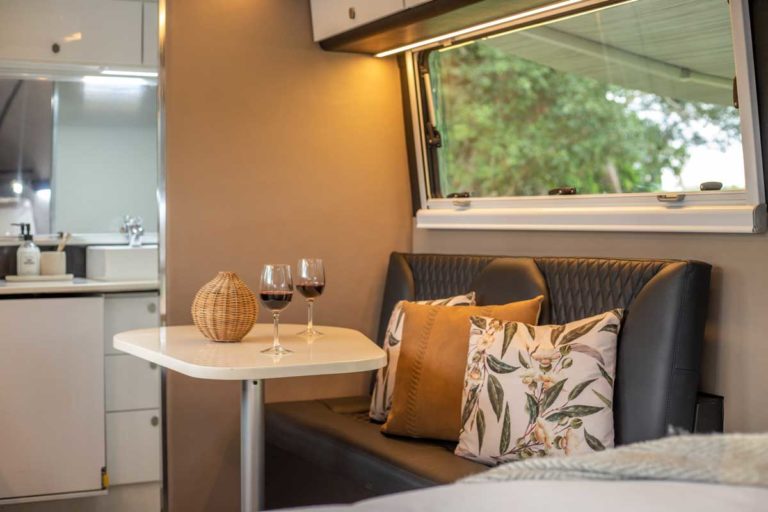 Kimberley-Kampers-Kruiser-E-Class-luxury-caravan-interior-seating-area-1200px