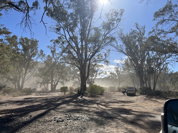 Dust lingers in the air from passing traffic along the Parachilna Gorge Road