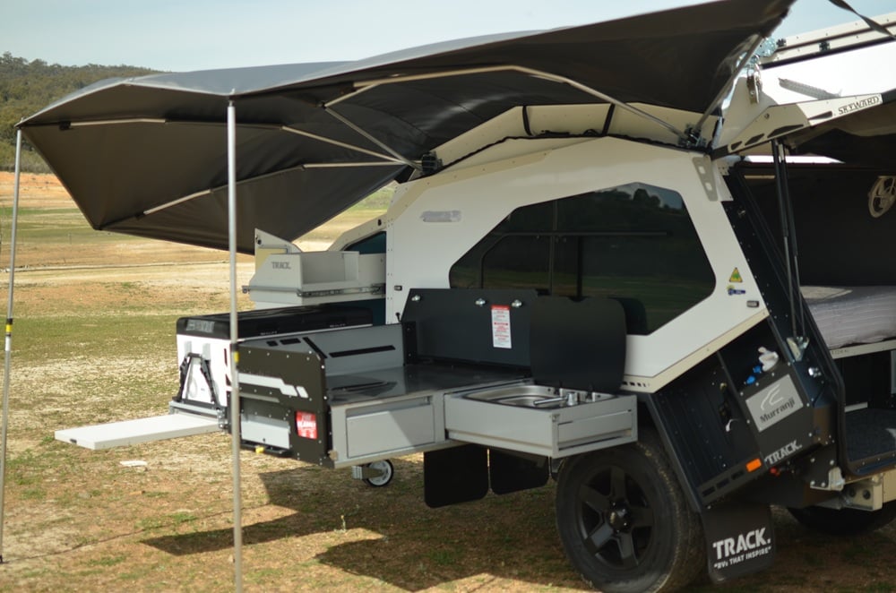Mk6 Tvan premium kitchen showing large preparation area, storage drawers, sink and weather protection.