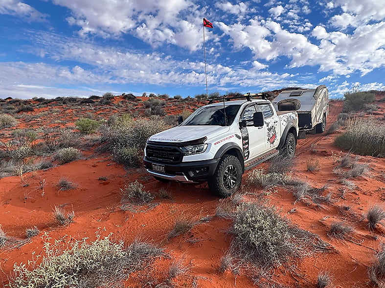 Ford Ranger Raptor towing a Track Trailer Tvan through remote desert country on the Madigan Line