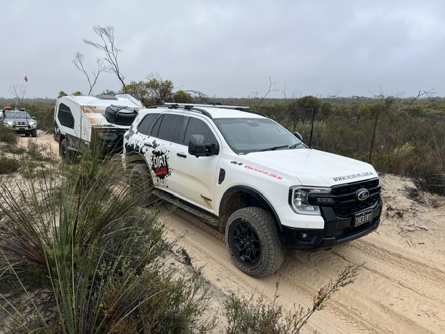 Ford Everest Tremor towing a Track Trailer Mk6 Tvan through sandy off-road terrain during Canning Stock Route preparation testing.