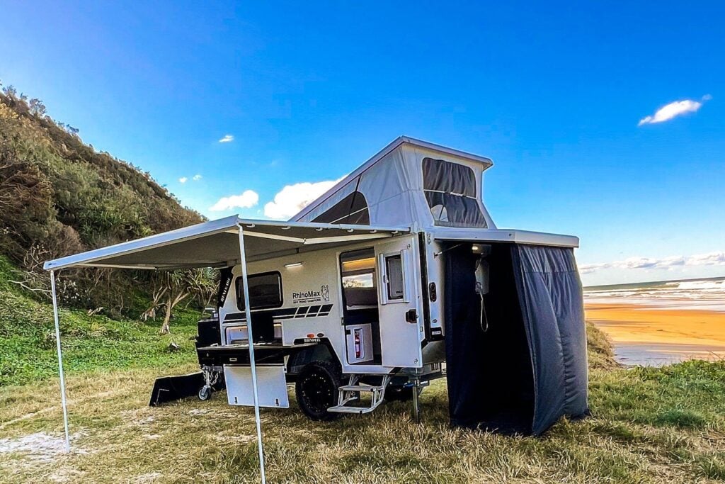 Rhinomax Renegade 12 set up at camp with awning